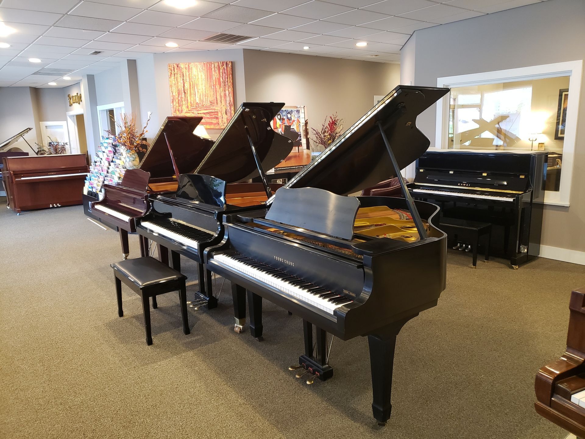 Piano showroom with multiple pianos on display